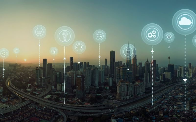 City skyline at dusk overlaid with connected network icons